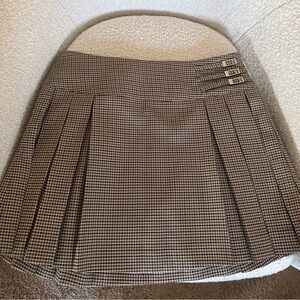 Meshki Pleated Buckle Mini Skirt